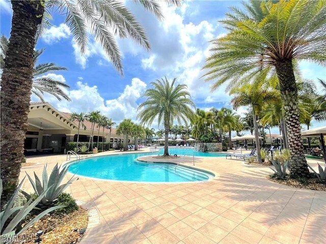 3813 Columbia Ct, Naples, FL 34119 - community pool with a patio