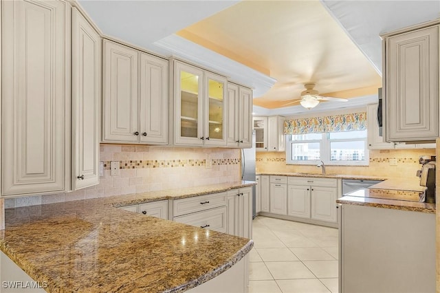 7150 Estero Blvd Unit 706, Fort Myers Beach, FL 33931 - kitchen with a tray ceiling, a sink, a ceiling fan, and tasteful backsplash
