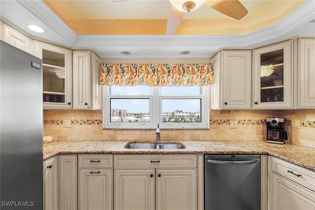 7150 Estero Blvd Unit 706, Fort Myers Beach, FL 33931 - kitchen with stainless steel appliances, a sink, a ceiling fan, backsplash, and glass insert cabinets