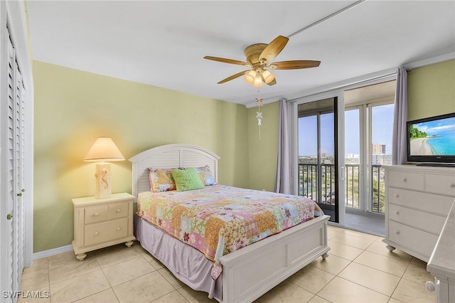7150 Estero Blvd Unit 706, Fort Myers Beach, FL 33931 - bedroom with access to outside, light tile patterned flooring, ceiling fan, and baseboards