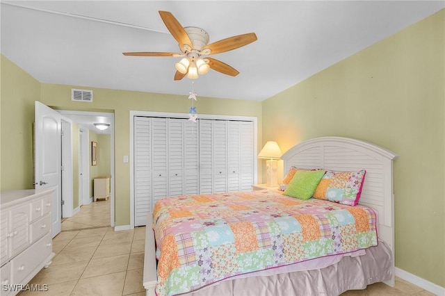 7150 Estero Blvd Unit 706, Fort Myers Beach, FL 33931 - bedroom with baseboards, light tile patterned flooring, ceiling fan, and a closet