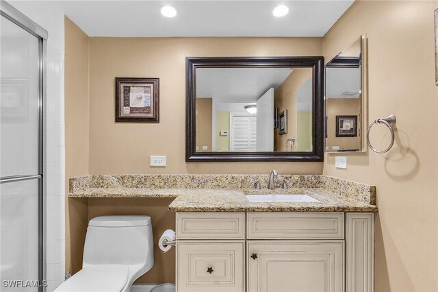 7150 Estero Blvd Unit 706, Fort Myers Beach, FL 33931 - full bathroom with toilet, vanity, and a shower with door