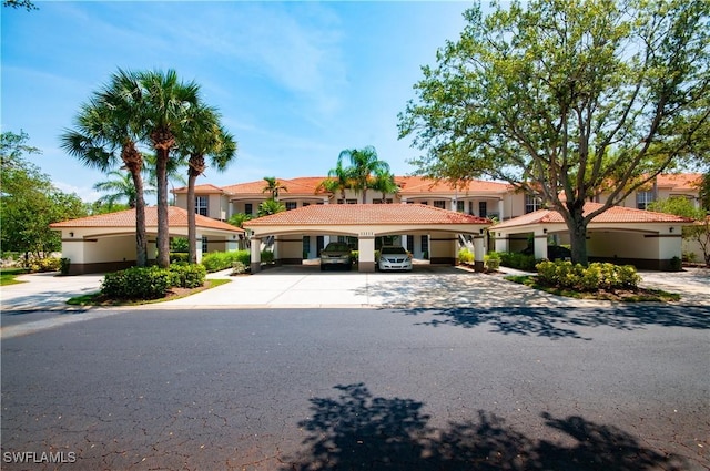 11111 Corsia Trieste Way Unit 101, Bonita Springs, FL 34135 - mediterranean / spanish-style home with stucco siding and a tile roof