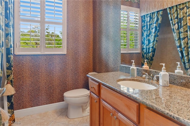 11111 Corsia Trieste Way Unit 101, Bonita Springs, FL 34135 - bathroom with tile patterned floors, vanity, and wallpapered walls