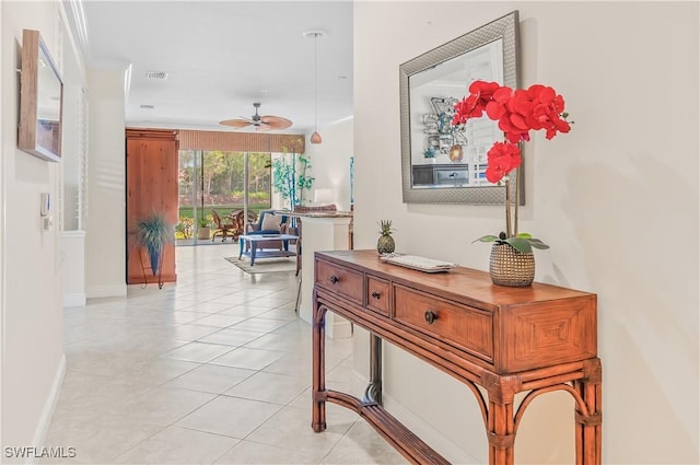 11111 Corsia Trieste Way Unit 101, Bonita Springs, FL 34135 - corridor featuring light tile patterned floors and baseboards