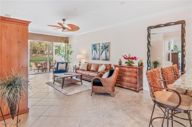 11111 Corsia Trieste Way Unit 101, Bonita Springs, FL 34135 - living room featuring a ceiling fan, ornamental molding, and light tile patterned floors