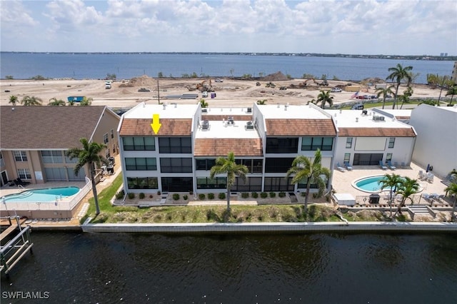 4210 SE 20th Pl Unit A8, Cape Coral, FL 33904 - aerial view of a pool area and a nearby body of water