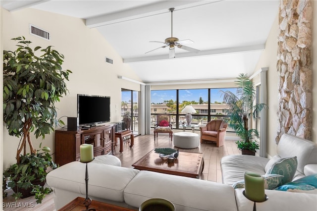 4210 SE 20th Pl Unit A8, Cape Coral, FL 33904 - living room with beam ceiling, ceiling fan, plenty of natural light, wood finished floors, and high vaulted ceiling
