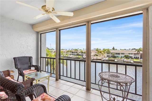 4210 SE 20th Pl Unit A8, Cape Coral, FL 33904 - sunroom / solarium featuring a water view, a textured wall, tile patterned floors, and a residential view