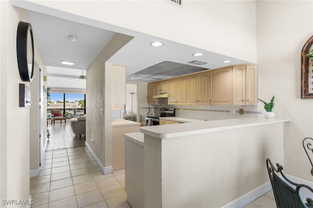 4210 SE 20th Pl Unit A8, Cape Coral, FL 33904 - kitchen with stainless steel electric stove, light brown cabinets, light tile patterned floors, light countertops, and recessed lighting