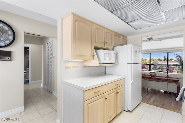 4210 SE 20th Pl Unit A8, Cape Coral, FL 33904 - kitchen with white appliances, light brown cabinetry, light countertops, and a ceiling fan