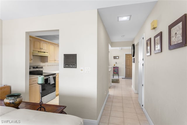 4210 SE 20th Pl Unit A8, Cape Coral, FL 33904 - corridor featuring light tile patterned flooring and baseboards