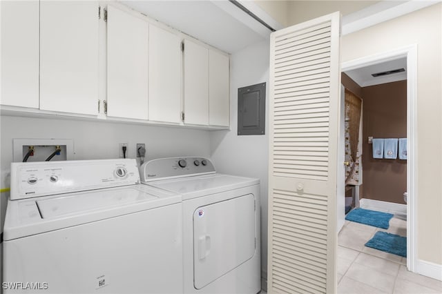 4210 SE 20th Pl Unit A8, Cape Coral, FL 33904 - washroom with cabinet space, washer and clothes dryer, electric panel, light tile patterned floors, and baseboards