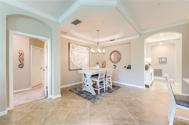 10517 Casella Way Unit 101, Fort Myers, FL 33913 - dining room featuring arched walkways, ornamental molding, light tile patterned flooring, a chandelier, and a raised ceiling