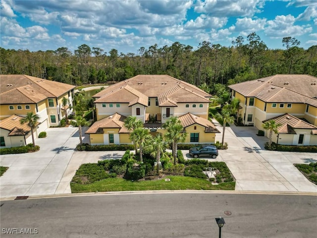10517 Casella Way Unit 101, Fort Myers, FL 33913 - view from above of property with a heavily wooded area