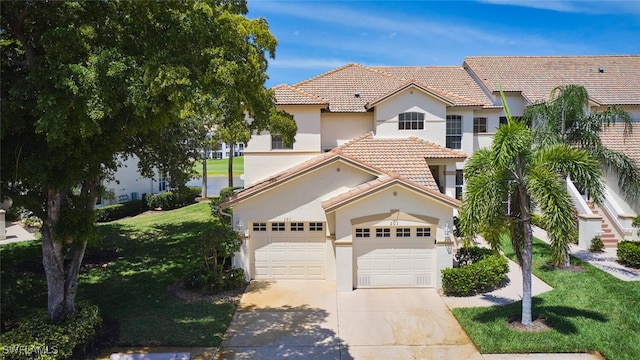9231 Bayberry Bnd Unit 101, Fort Myers, FL 33908 - mediterranean / spanish home with driveway, a tiled roof, stucco siding, and a front lawn