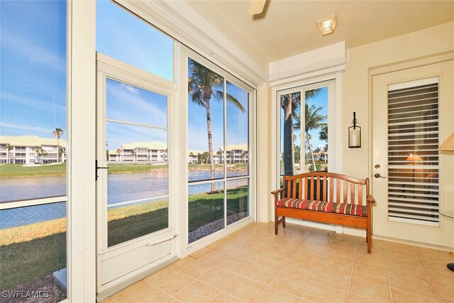 9231 Bayberry Bnd Unit 101, Fort Myers, FL 33908 - sunroom / solarium featuring a water view and tile patterned flooring