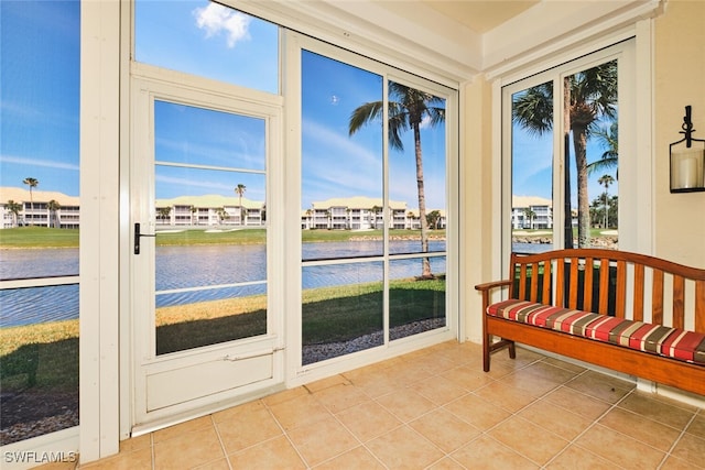 9231 Bayberry Bnd Unit 101, Fort Myers, FL 33908 - sunroom / solarium with tile patterned floors, a water view, and a residential view