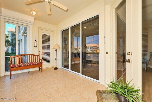 9231 Bayberry Bnd Unit 101, Fort Myers, FL 33908 - sunroom with a ceiling fan, tile patterned floors, and baseboards