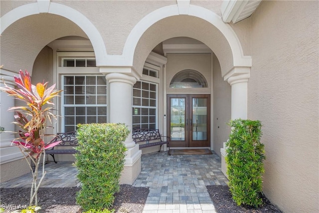 11041 Seminole Palm Way, Fort Myers, FL 33966 - doorway to property featuring stucco siding and french doors