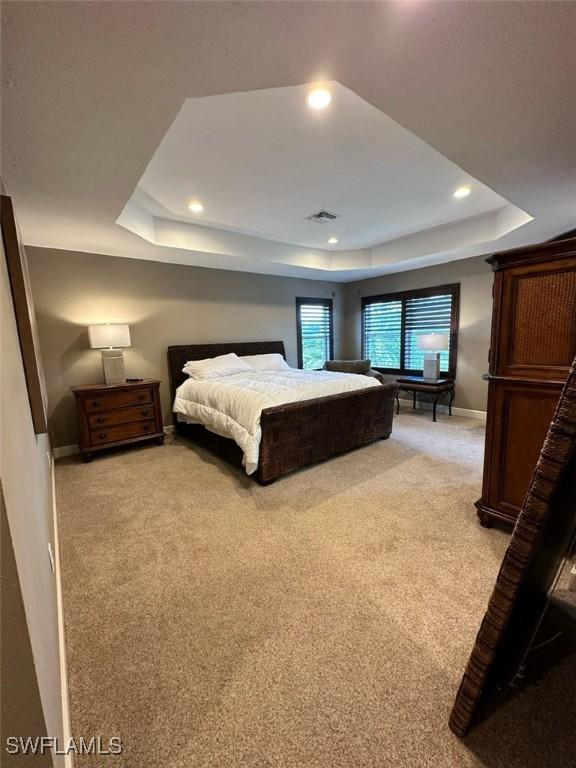 11041 Seminole Palm Way, Fort Myers, FL 33966 - bedroom with a raised ceiling, light carpet, recessed lighting, and baseboards