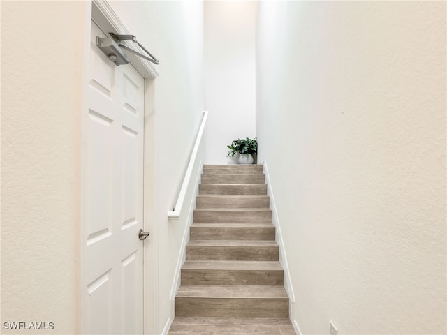 11796 Grand Belvedere Way Unit 202, Fort Myers, FL 33913 - staircase with wood finished floors