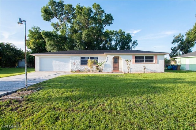 2330 Caladium Rd, Fort Myers, FL 33905 - ranch-style house featuring concrete driveway, an attached garage, and a front lawn