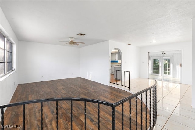 2330 Caladium Rd, Fort Myers, FL 33905 - unfurnished room featuring ceiling fan, arched walkways, and light wood-style floors