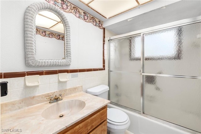 2330 Caladium Rd, Fort Myers, FL 33905 - full bathroom with vanity, enclosed tub / shower combo, and tile walls