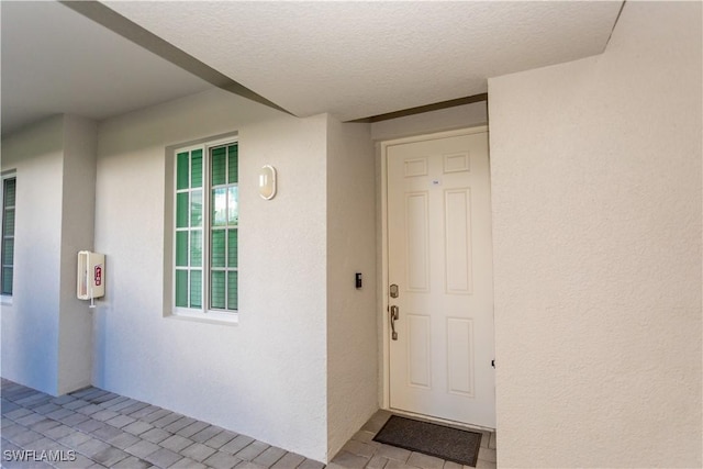 43000 Greenway Blvd Unit 114, Punta Gorda, FL 33982 - view of exterior entry with stucco siding