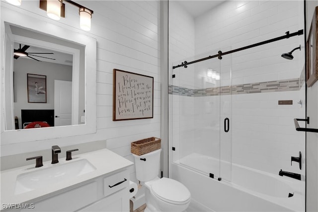 20150 Millrun Dr, Estero, FL 33928 - bathroom with vanity, combined bath / shower with glass door, toilet, and wooden walls