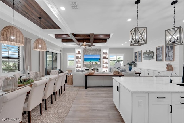 20150 Millrun Dr, Estero, FL 33928 - kitchen featuring light wood-type flooring, beamed ceiling, recessed lighting, open floor plan, and coffered ceiling