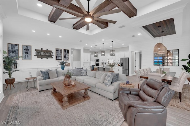 20150 Millrun Dr, Estero, FL 33928 - living room featuring coffered ceiling, light wood finished floors, a ceiling fan, recessed lighting, and beam ceiling