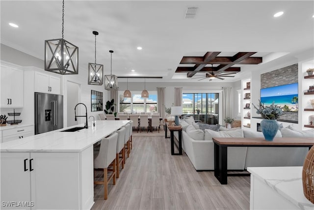 20150 Millrun Dr, Estero, FL 33928 - living room featuring coffered ceiling, recessed lighting, light wood-type flooring, beamed ceiling, and ornamental molding