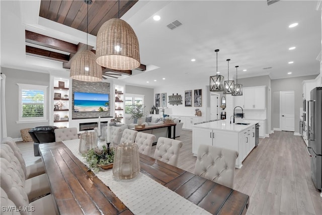 20150 Millrun Dr, Estero, FL 33928 - dining room with recessed lighting, light wood-style flooring, baseboards, a chandelier, and beamed ceiling