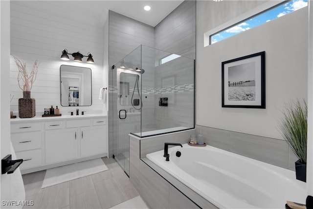 20150 Millrun Dr, Estero, FL 33928 - bathroom featuring vanity, a shower stall, a bath, and recessed lighting