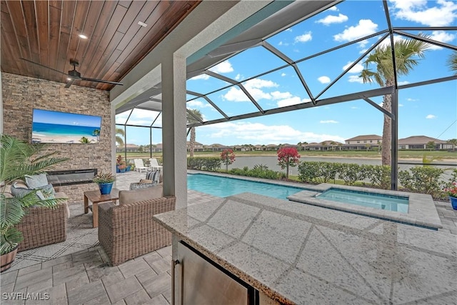 20150 Millrun Dr, Estero, FL 33928 - outdoor pool featuring an in-ground hot tub, a patio, glass enclosure, and an outdoor hangout area