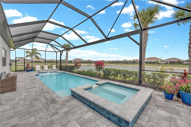 20150 Millrun Dr, Estero, FL 33928 - view of pool with a patio area, a water view, glass enclosure, and a pool with connected hot tub