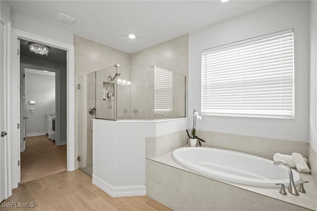 28041 Captiva Shell Loop, Bonita Springs, FL 34135 - full bathroom featuring a bath, a shower stall, wood finished floors, and recessed lighting