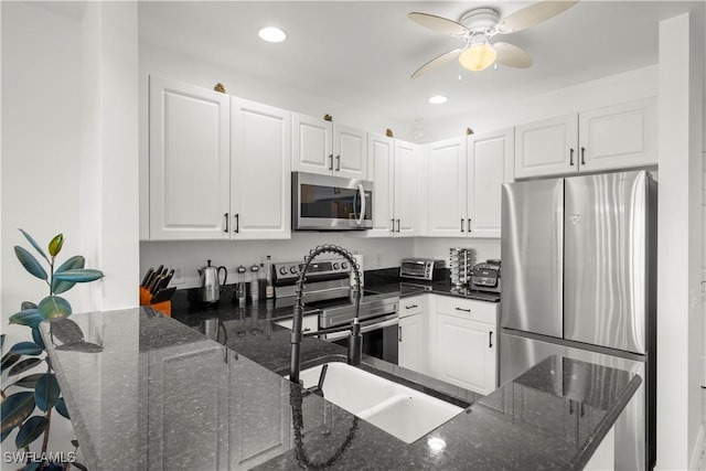 2743 1st St Unit 110, Fort Myers, FL 33916 - kitchen with stainless steel appliances, white cabinetry, a peninsula, and recessed lighting