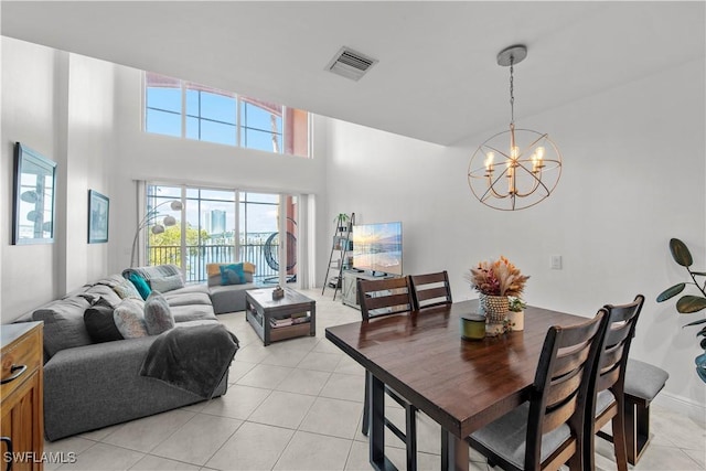 2743 1st St Unit 110, Fort Myers, FL 33916 - dining room featuring a chandelier and light tile patterned floors