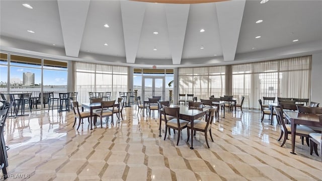2743 1st St Unit 110, Fort Myers, FL 33916 - dining space with plenty of natural light and beam ceiling