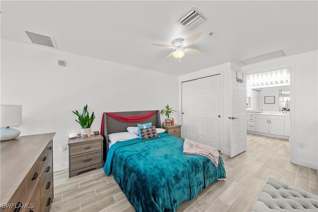 2743 1st St Unit 110, Fort Myers, FL 33916 - bedroom with wood finish floors, a closet, baseboards, and attic access