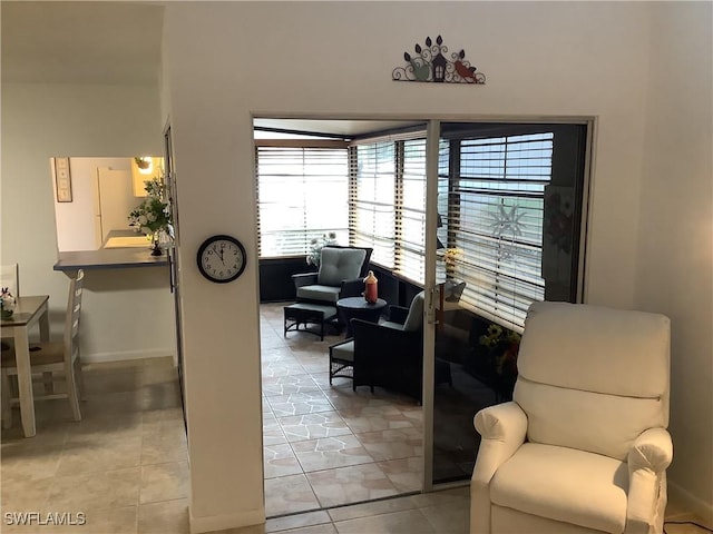 18437 Orangecrest Ct, Lehigh Acres, FL 33936 - living area with baseboards and light tile patterned floors