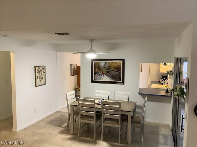 18437 Orangecrest Ct, Lehigh Acres, FL 33936 - dining space featuring a ceiling fan and baseboards