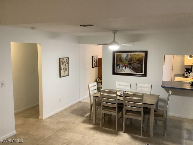 18437 Orangecrest Ct, Lehigh Acres, FL 33936 - dining room featuring ceiling fan, baseboards, and light tile patterned floors
