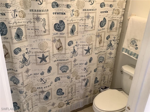 18437 Orangecrest Ct, Lehigh Acres, FL 33936 - full bathroom with toilet and a shower with shower curtain
