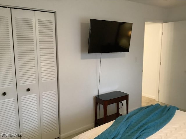 18437 Orangecrest Ct, Lehigh Acres, FL 33936 - bedroom with a closet and baseboards