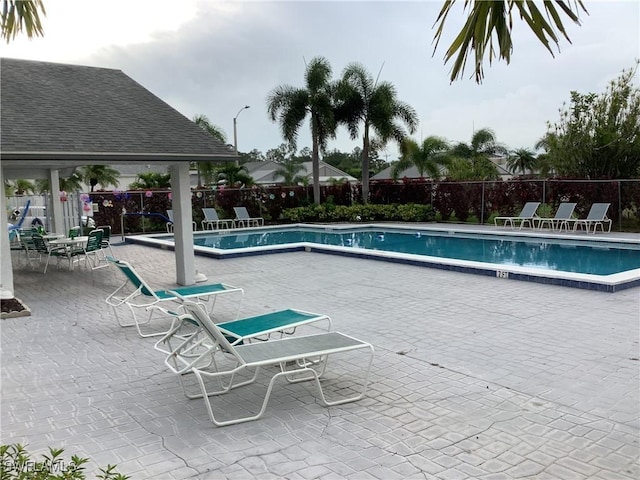 18437 Orangecrest Ct, Lehigh Acres, FL 33936 - community pool with a patio area