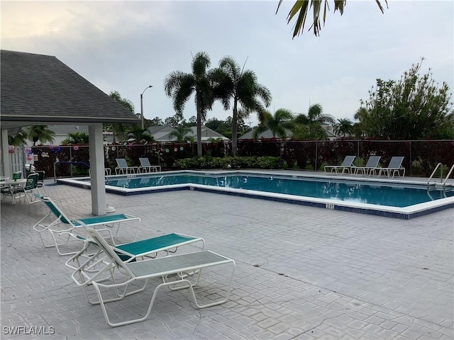 18437 Orangecrest Ct, Lehigh Acres, FL 33936 - community pool with a patio
